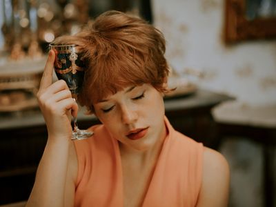 Person holding a balancing pose with grace and focus.